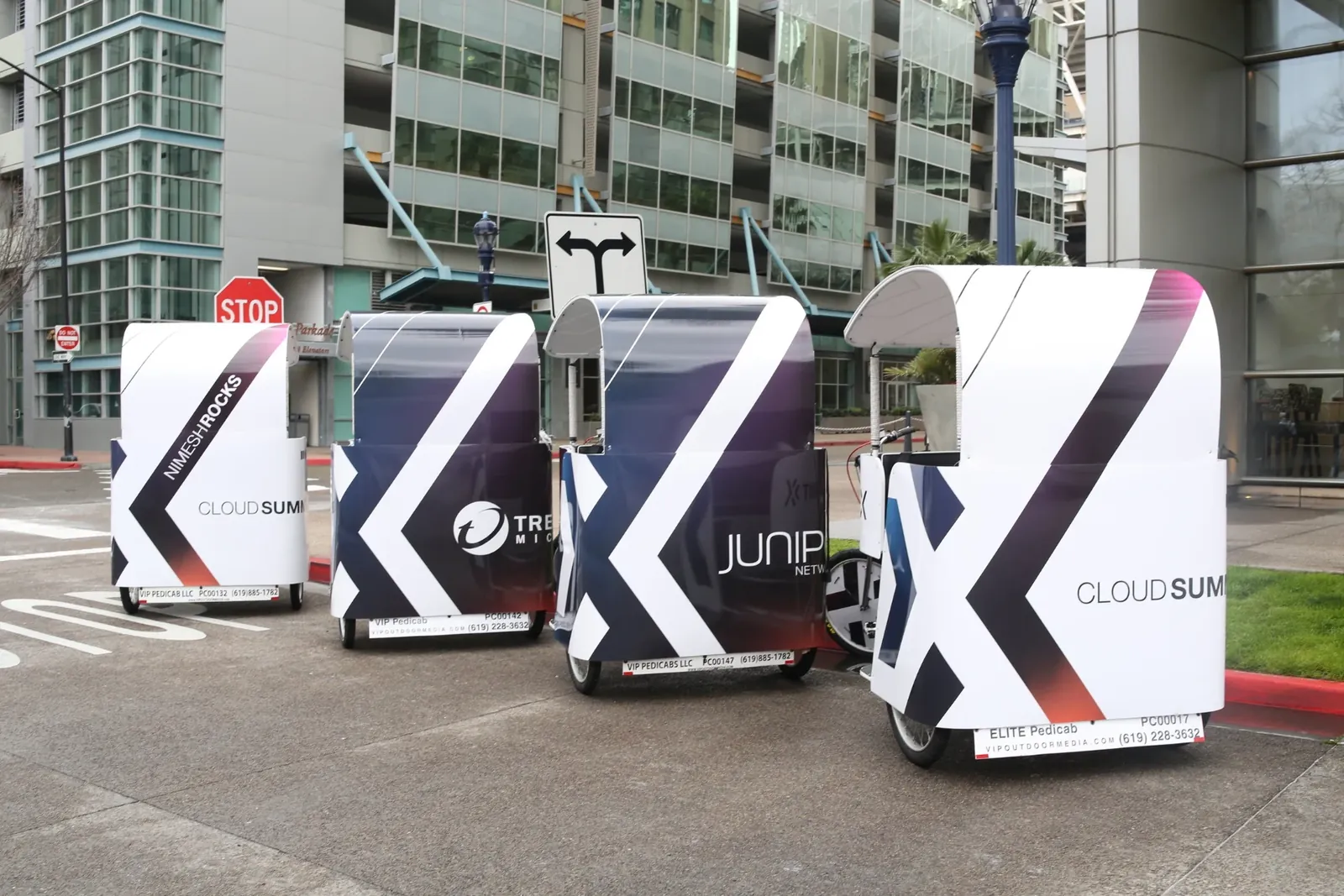 Custom-wrapped sponsor pedicabs at a San Diego convention